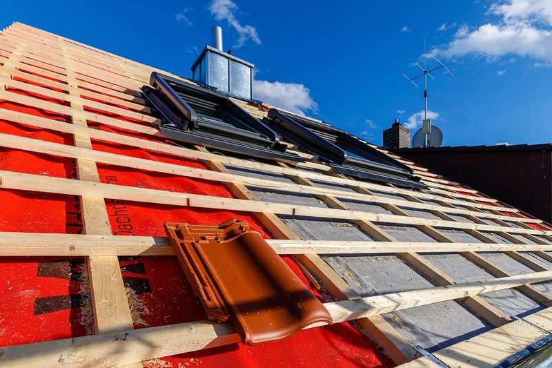 Pitched roof with new battens as tiles are laid